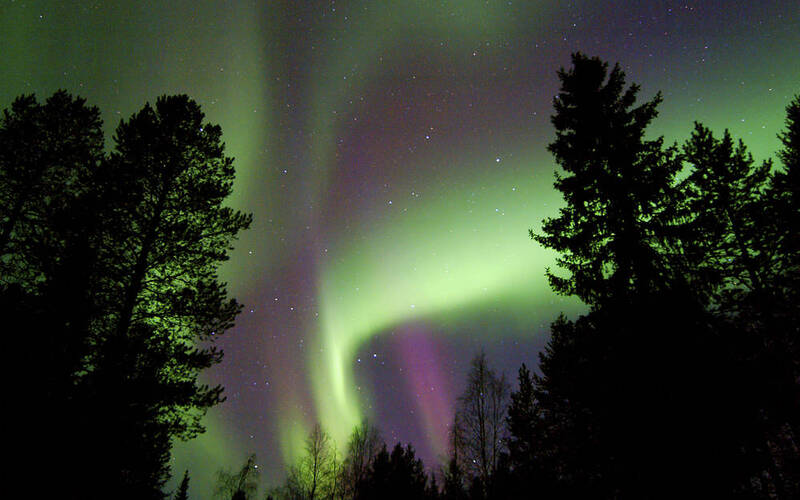 Search of the Northern Lights by snowmobile
